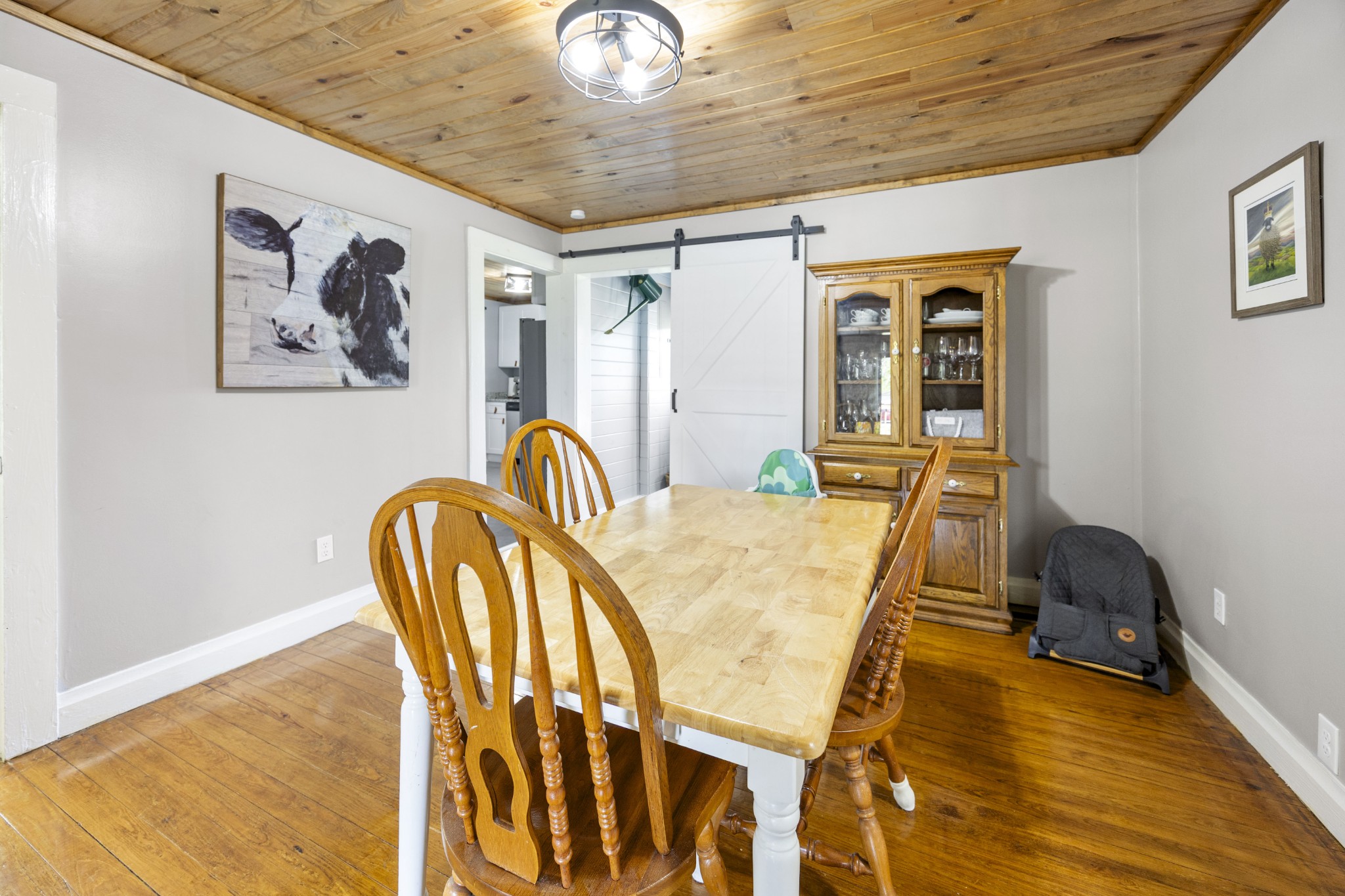 905 Nicholson Street Decherd, TN 37324 - Photo 7 of 27 a view of a dining room with furniture and wooden floor
