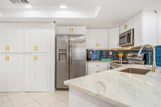 a bed room with a bed a television and a window