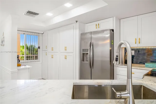 a spacious bedroom with a bed wooden floor and window