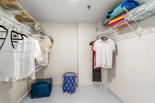 a living room with furniture flowerpot and a mirror