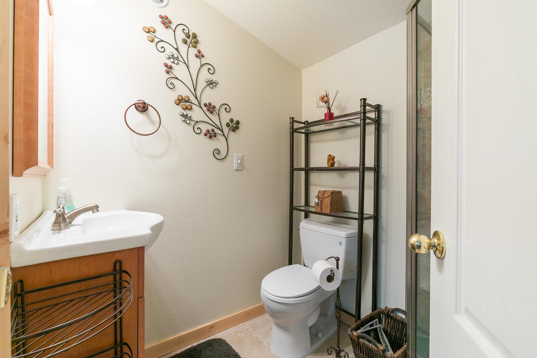 13746 Mogul Way Truckee, CA 96161 - Photo 11 of 21 a bathroom with a sink vanity mirror and toilet