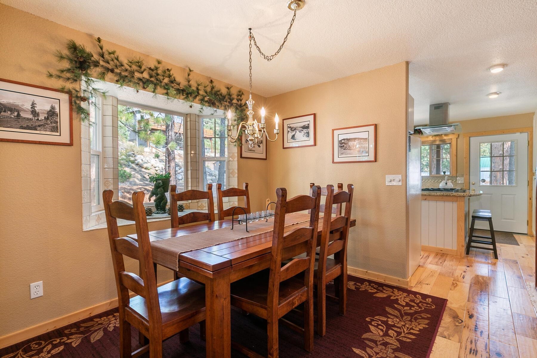 13746 Mogul Way Truckee, CA 96161 - Photo 17 of 21 a view of a dining room with furniture window and wooden floor