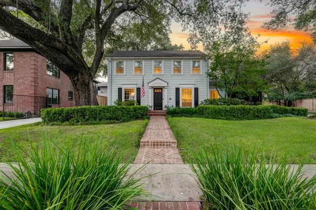 a front view of a house with yard