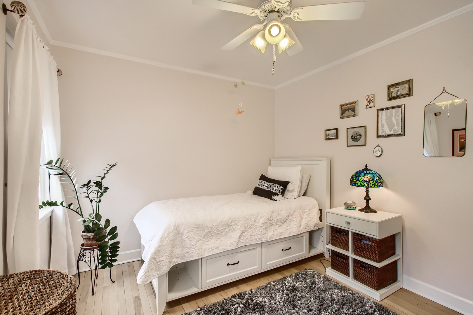 50 Northgate Road Riverside, IL 60546 - Photo 14 of 33 a bedroom with a bed and a chandelier