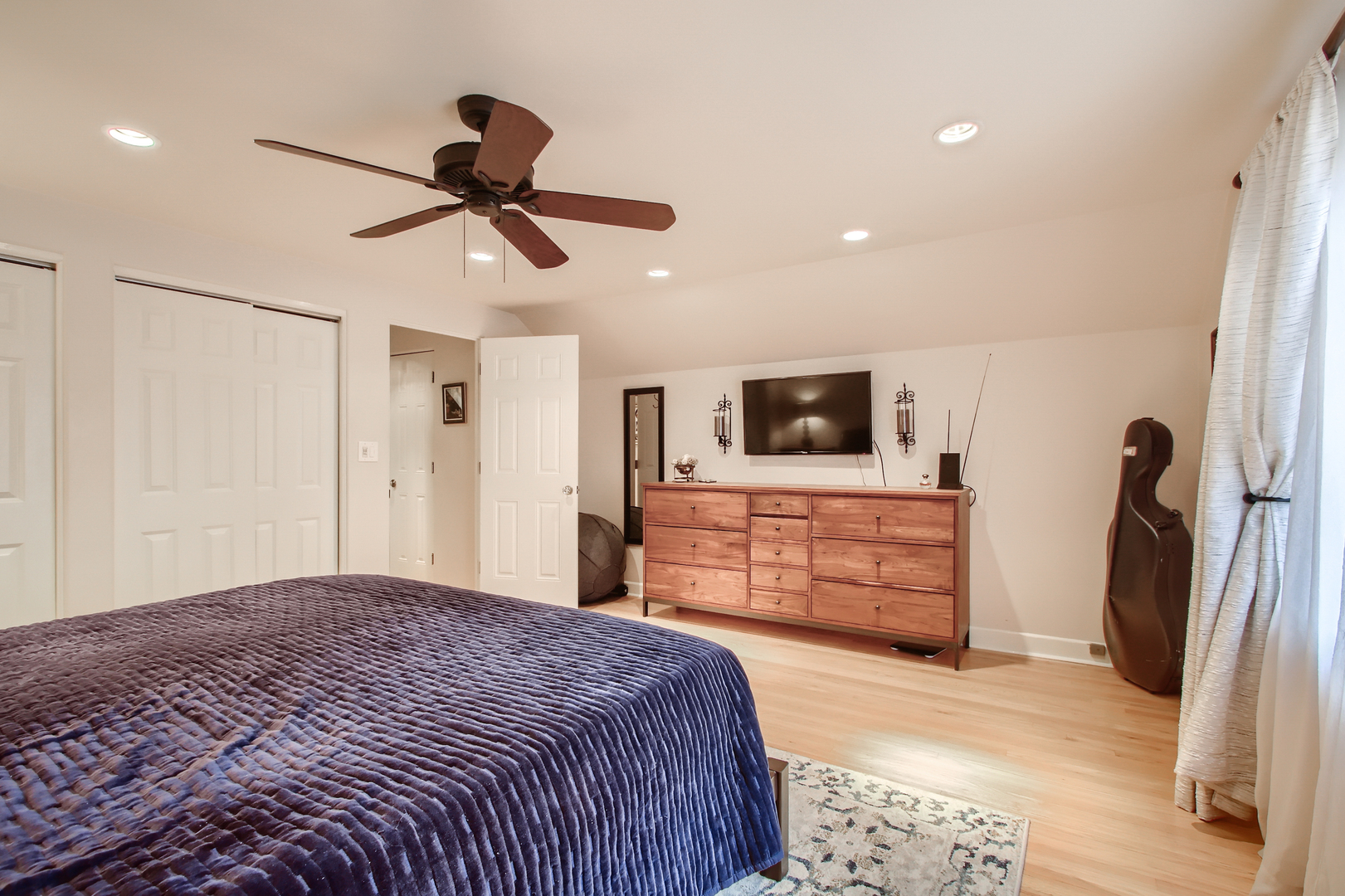 50 Northgate Road Riverside, IL 60546 - Photo 17 of 33 a bedroom with a bed and a flat screen tv