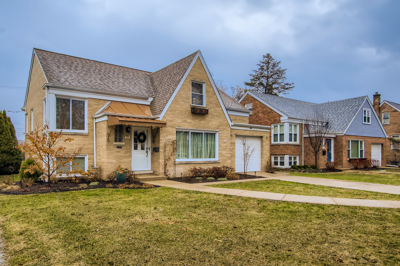 50 Northgate Road Riverside, IL 60546 - Photo 2 of 33 a front view of a house with a yard