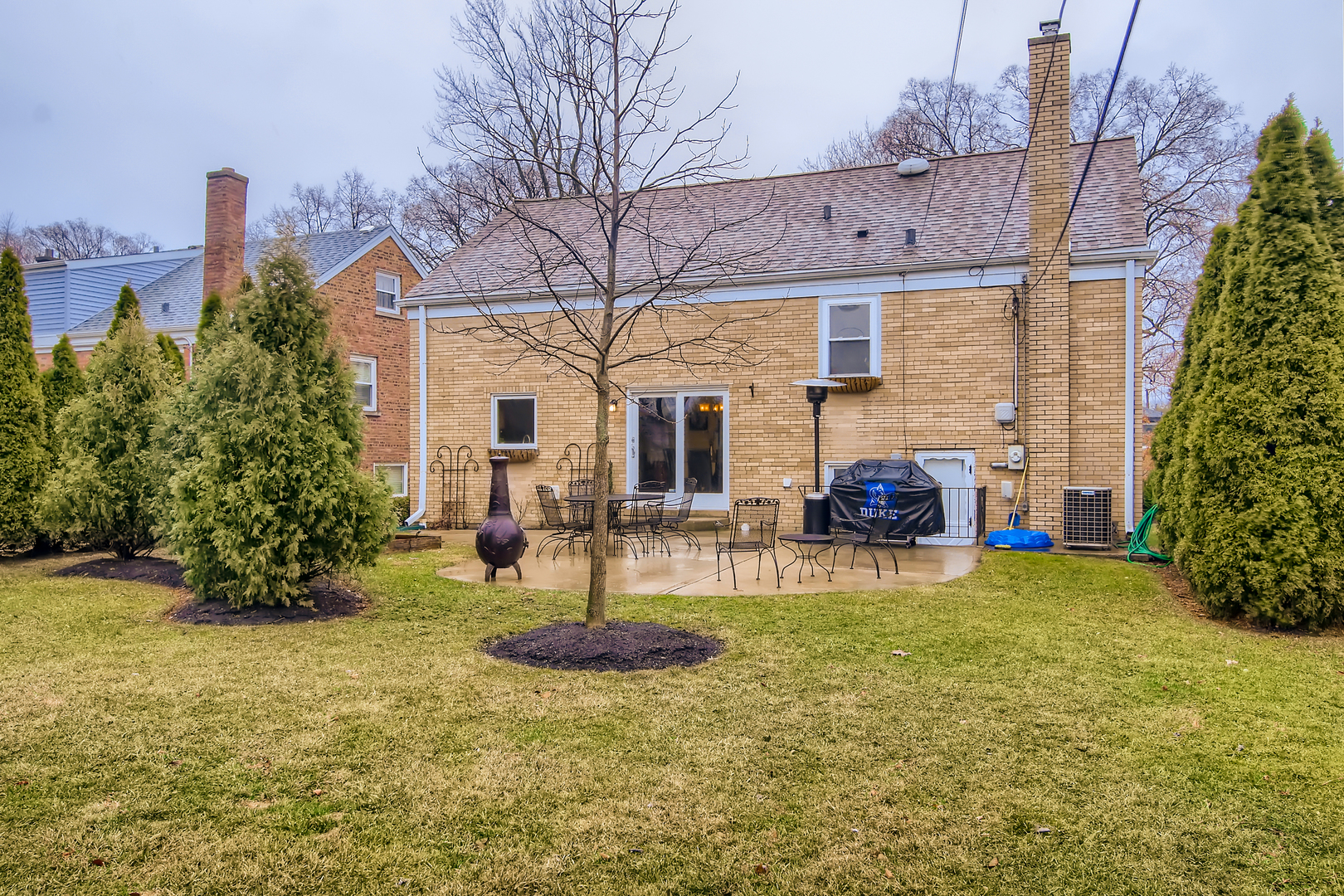 50 Northgate Road Riverside, IL 60546 - Photo 26 of 33 a view of a house with backyard and sitting area