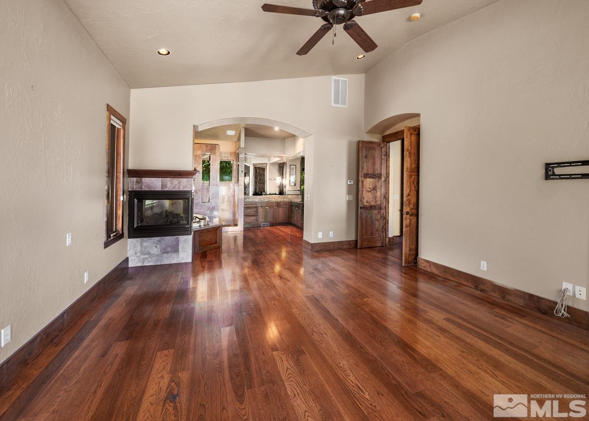 4145 Lone Tree Lane Reno, NV 89511 - Photo 11 of 37 a view of a living room with furniture and wooden floor