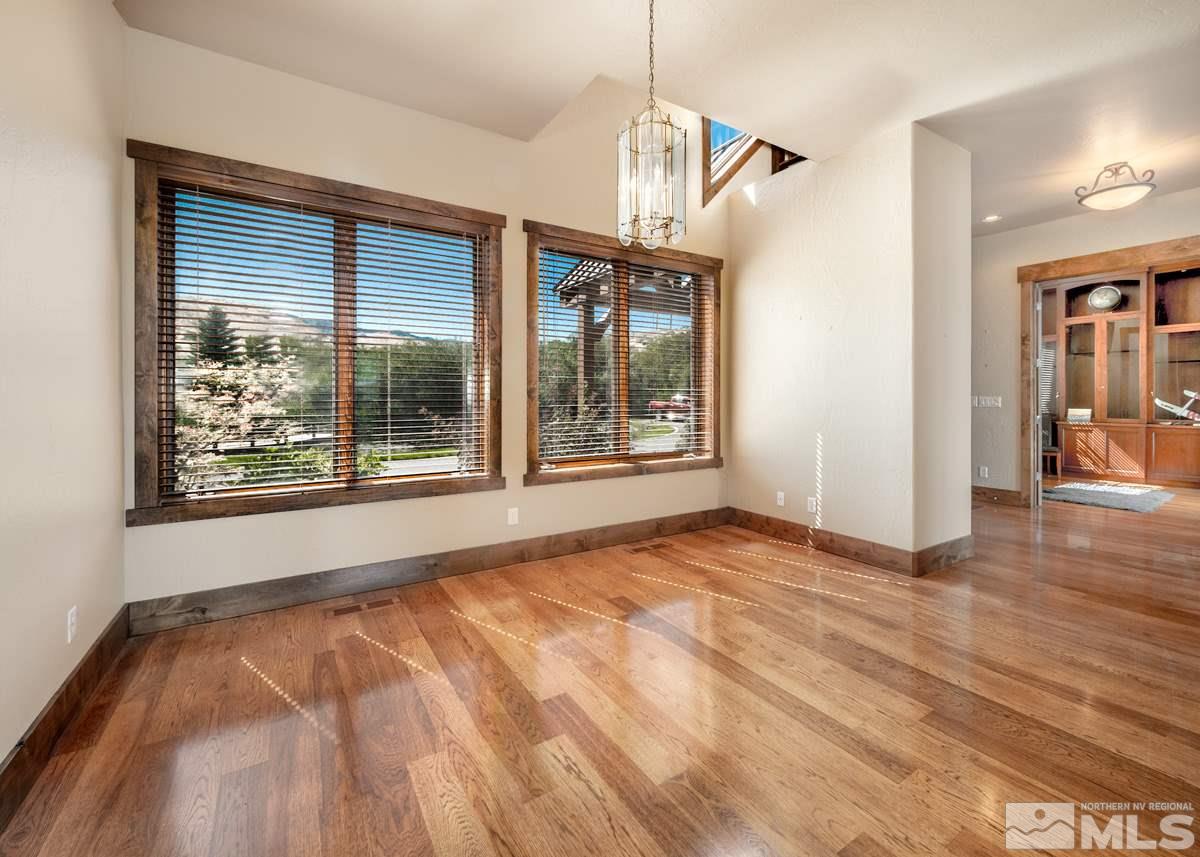 4145 Lone Tree Lane Reno, NV 89511 - Photo 14 of 37 a view of an empty room with wooden floor and a window