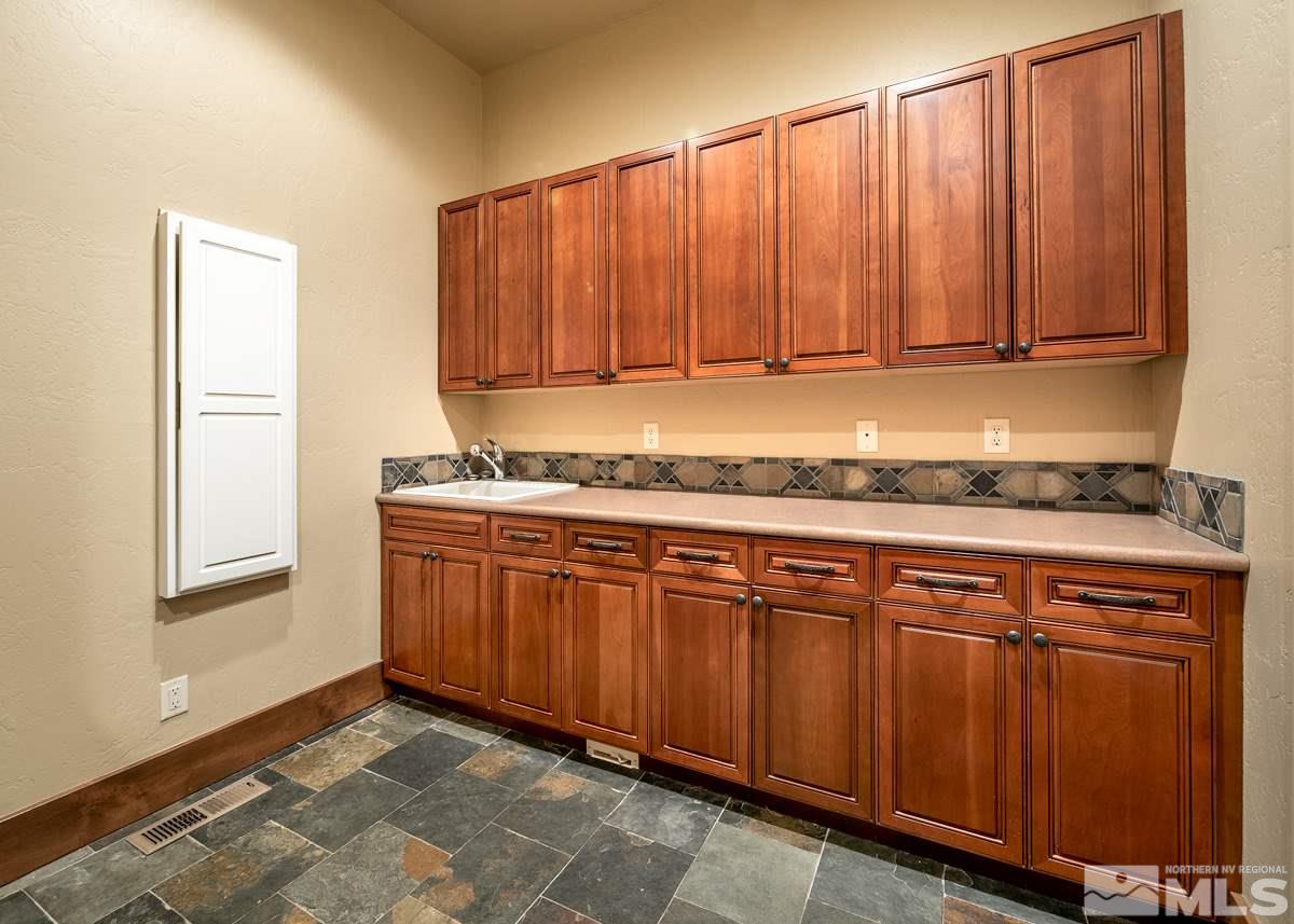 4145 Lone Tree Lane Reno, NV 89511 - Photo 24 of 37 a view of a kitchen with granite countertop wooden cabinets