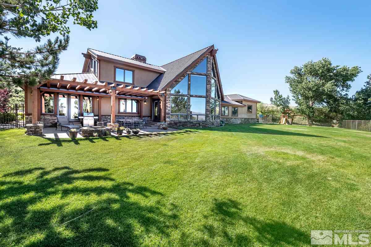 4145 Lone Tree Lane Reno, NV 89511 - Photo 27 of 37 a view of a house with a yard and sitting area