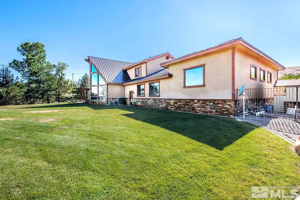 4145 Lone Tree Lane Reno, NV 89511 - Photo 28 of 37 a view of a house with a yard