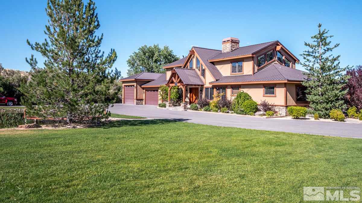 4145 Lone Tree Lane Reno, NV 89511 - Photo 33 of 37 a front view of a house with a garden and plants
