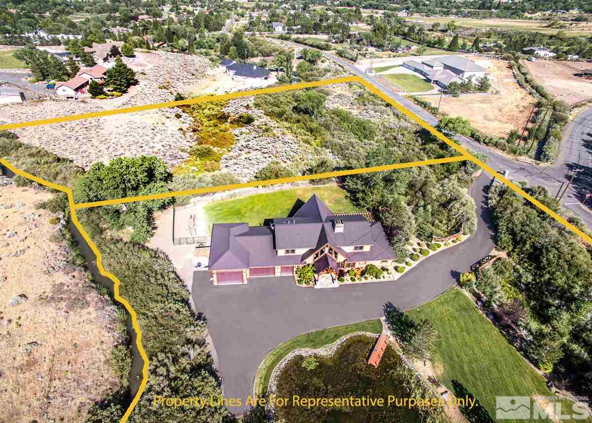 4145 Lone Tree Lane Reno, NV 89511 - Photo 37 of 37 an aerial view of a house a yard and a fountain