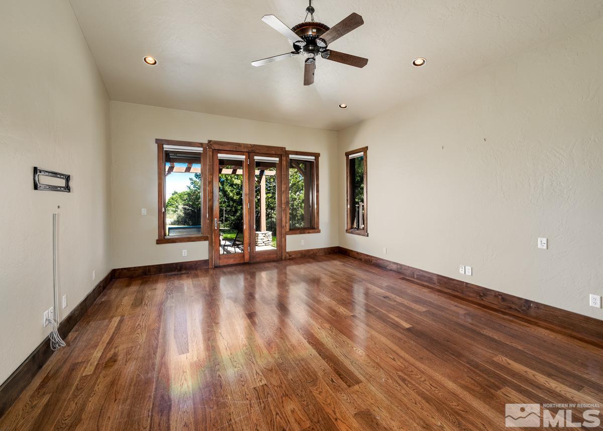 4145 Lone Tree Lane Reno, NV 89511 - Photo 10 of 37 wooden floor in an empty room with a window