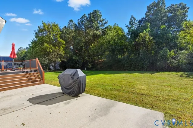 a view of a swimming pool with a chair and tables