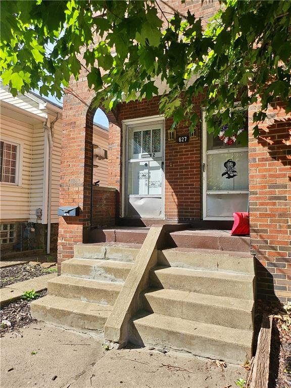 627 5th Avenue, Unit 2 Coraopolis, PA 15108 - Photo 1 of 22 a front view of a house with a garden