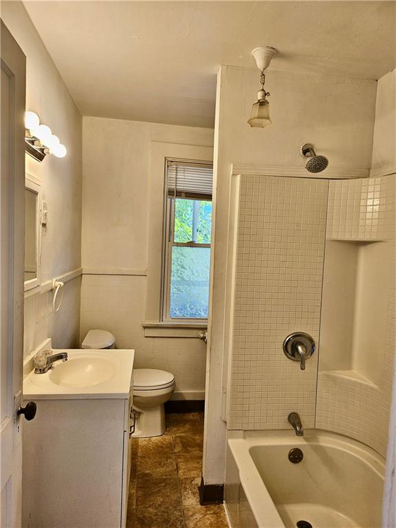 627 5th Avenue, Unit 2 Coraopolis, PA 15108 - Photo 14 of 22 a bathroom with a sink a toilet and shower
