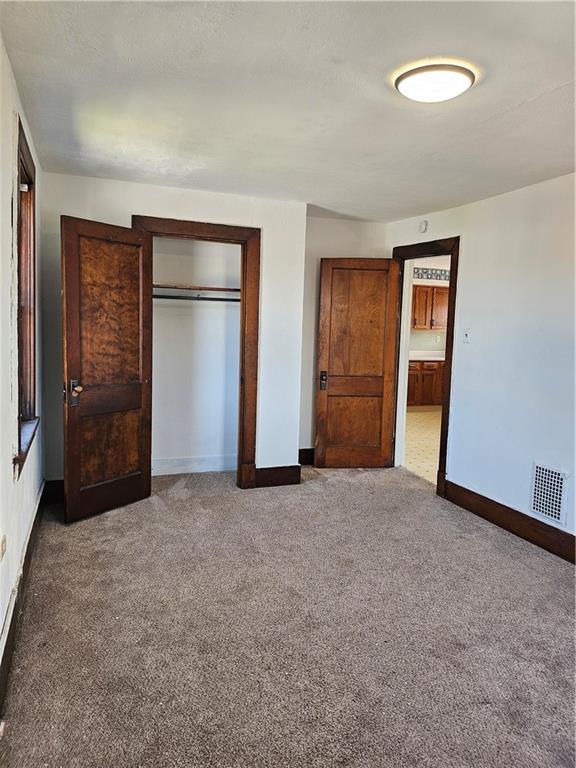 627 5th Avenue, Unit 2 Coraopolis, PA 15108 - Photo 16 of 22 an empty room with closet and mirror