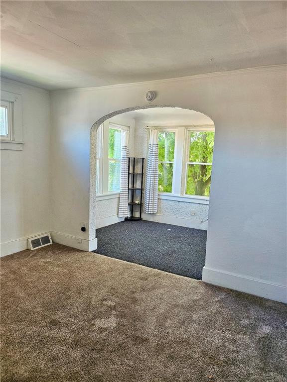 627 5th Avenue, Unit 2 Coraopolis, PA 15108 - Photo 7 of 22 a view of an empty room with large windows