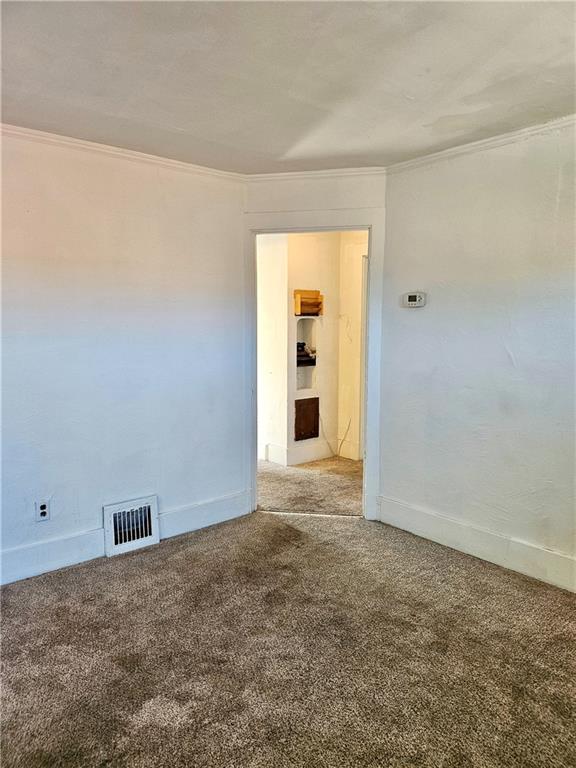 627 5th Avenue, Unit 2 Coraopolis, PA 15108 - Photo 8 of 22 an empty room with an entryway