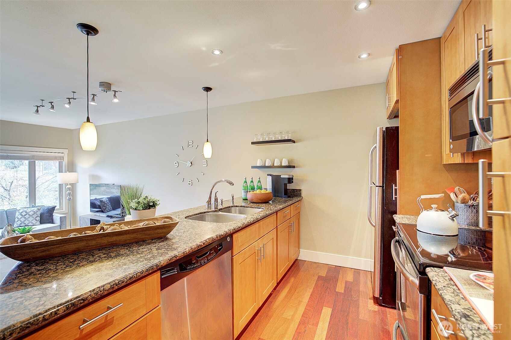 8503 Bowdoin Way, Unit 203 Edmonds, WA 98026 - Photo 11 of 19 a kitchen with a sink and a wooden floor