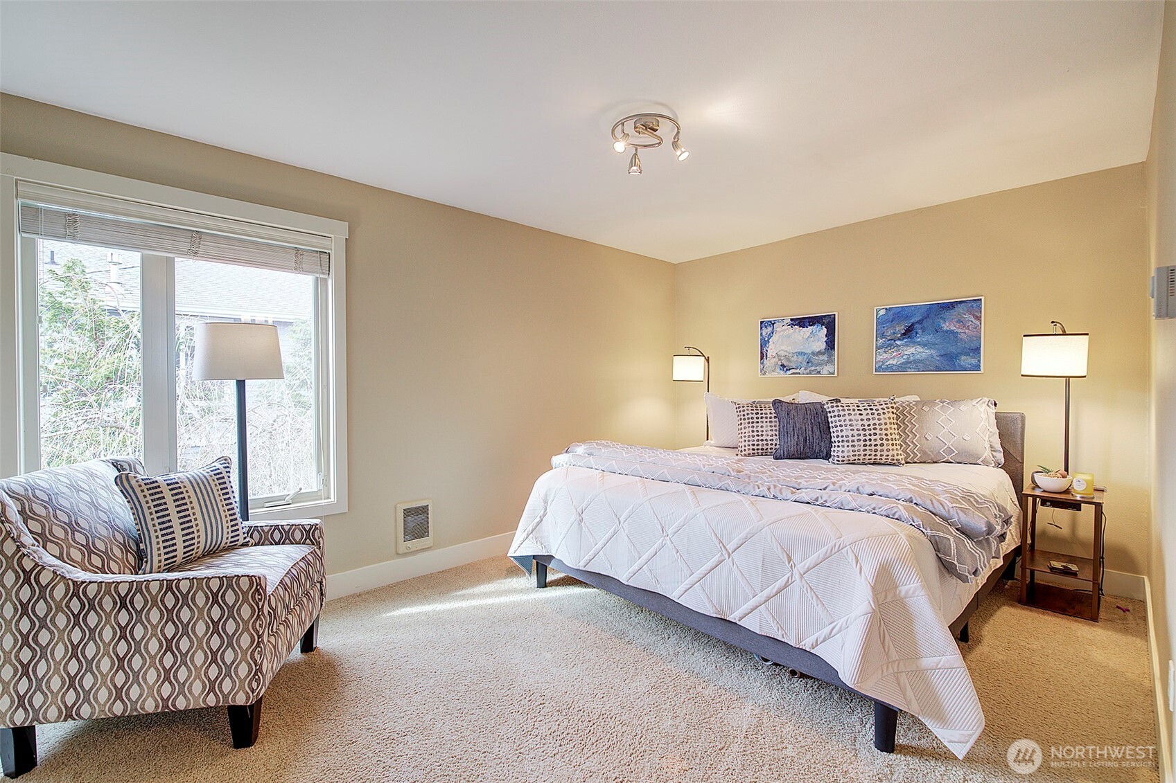 8503 Bowdoin Way, Unit 203 Edmonds, WA 98026 - Photo 12 of 19 a spacious bedroom with a bed and window