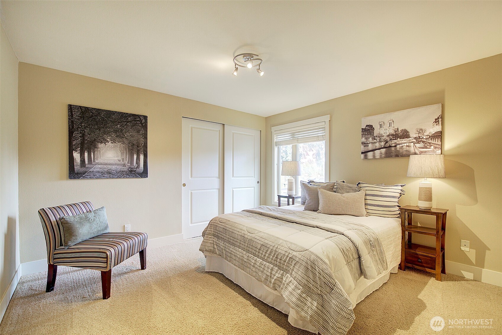 8503 Bowdoin Way, Unit 203 Edmonds, WA 98026 - Photo 14 of 19 a bedroom with a bed and a couch