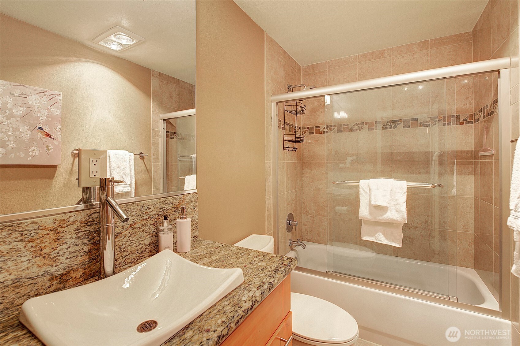 8503 Bowdoin Way, Unit 203 Edmonds, WA 98026 - Photo 16 of 19 a bathroom with a granite countertop sink toilet and shower