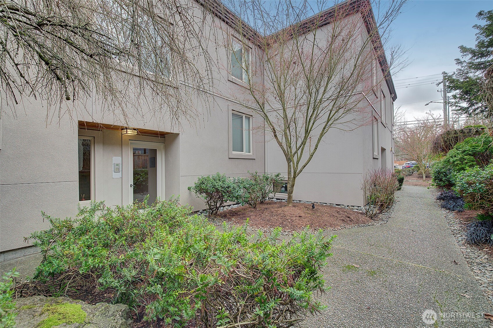8503 Bowdoin Way, Unit 203 Edmonds, WA 98026 - Photo 19 of 19 a view of a house with a yard