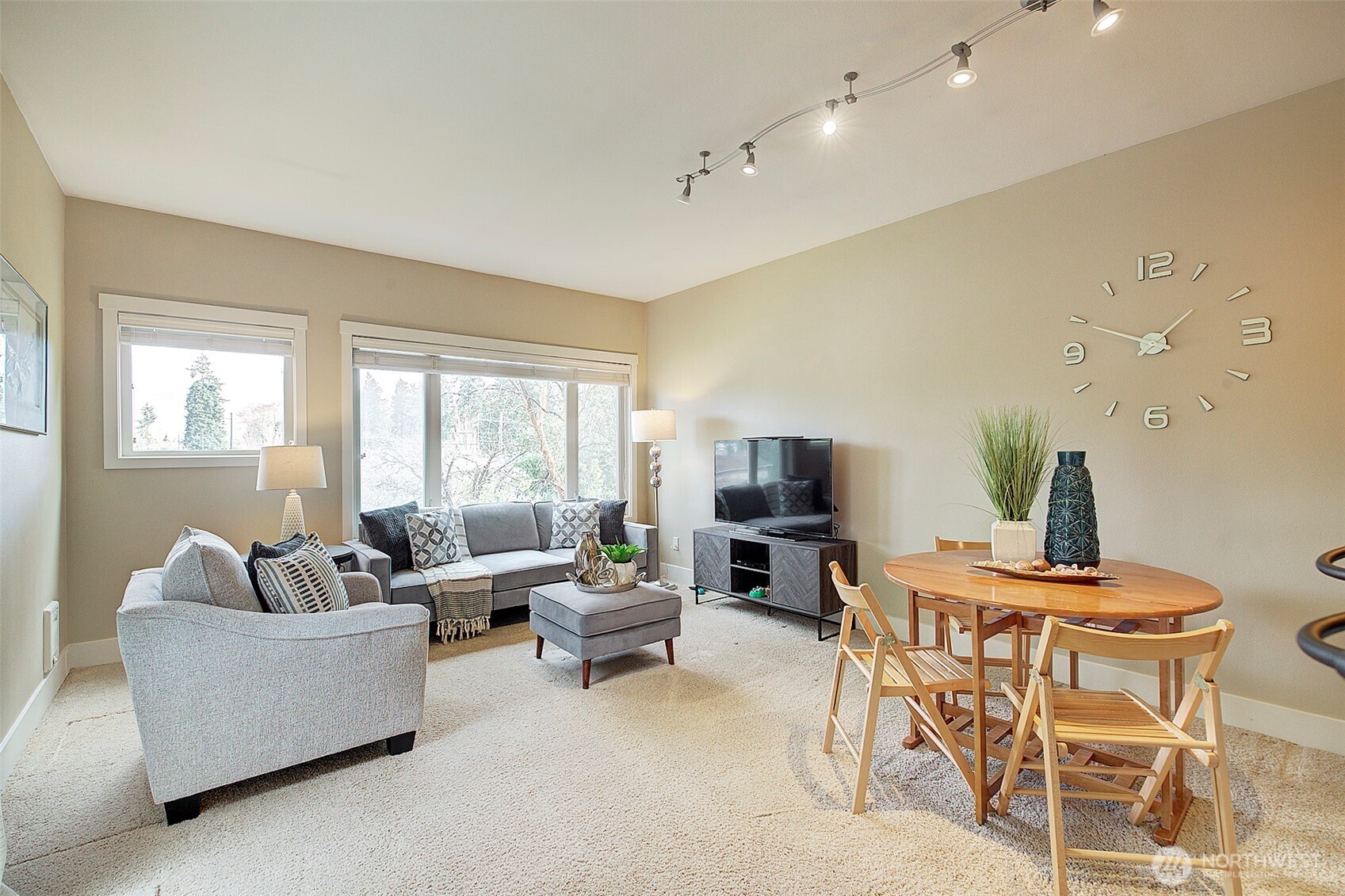 8503 Bowdoin Way, Unit 203 Edmonds, WA 98026 - Photo 6 of 19 a living room with furniture and a flat screen tv