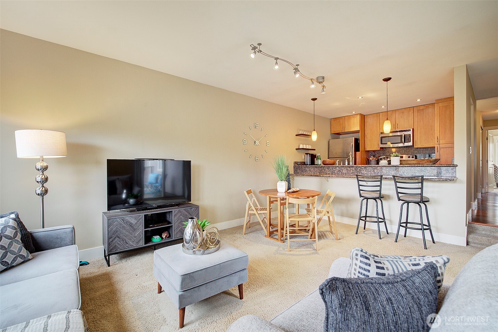 8503 Bowdoin Way, Unit 203 Edmonds, WA 98026 - Photo 7 of 19 a living room with furniture and a flat screen tv