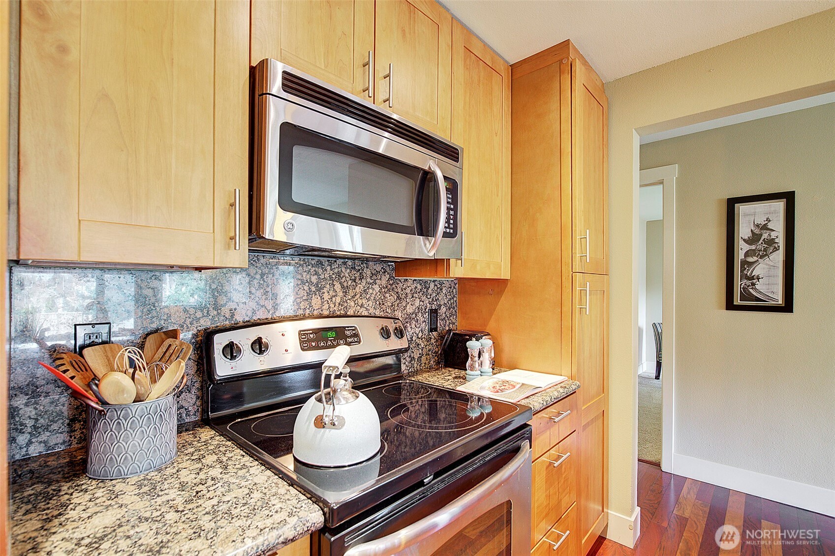 8503 Bowdoin Way, Unit 203 Edmonds, WA 98026 - Photo 10 of 19 a kitchen with a stove and a microwave