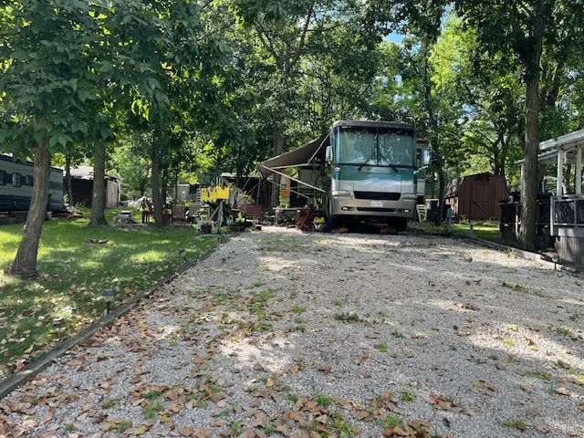 a small hurt is sitting in the middle of a yard