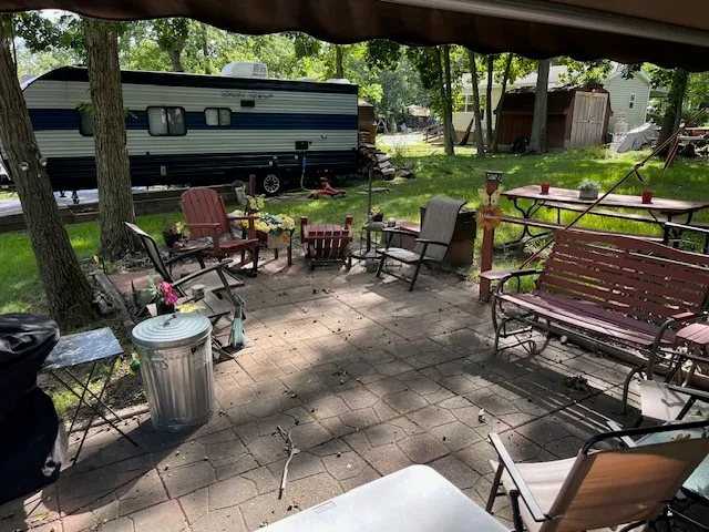 a view of a chairs and tables in the patio