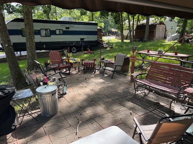2795 East 28th Road Marseilles, IL 61341 - Photo 7 of 50 a view of a chairs and tables in the patio