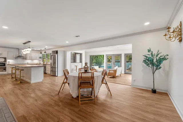 a view of a dining room with furniture window and wooden floor