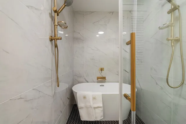 a view of a swimming pool with a patio and a yard