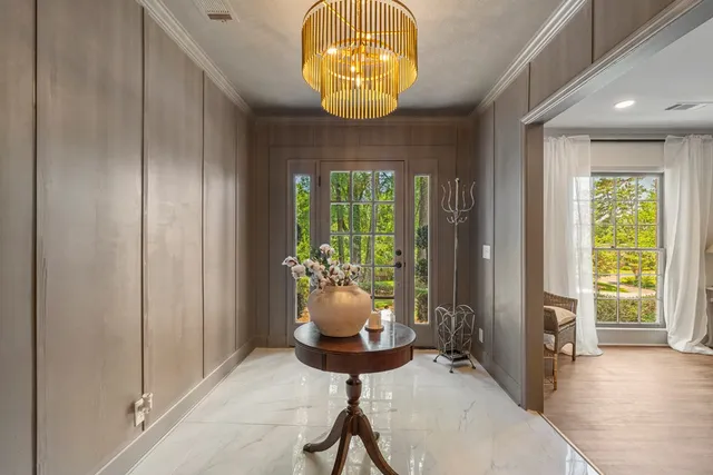 a room with furniture and chandelier