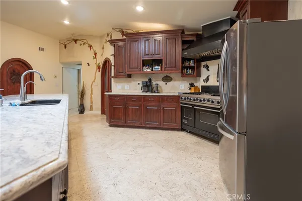 a bedroom with bed and a potted plant