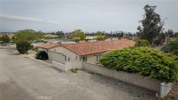 an aerial view of a house with yard swimming pool and outdoor seating