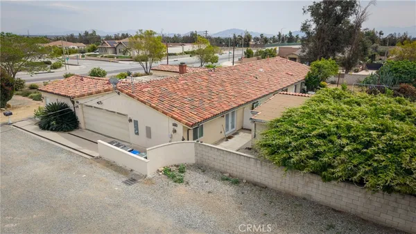 an aerial view of houses with outdoor space