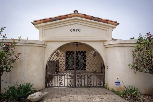 a large kitchen with a table and chairs