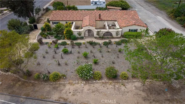 a kitchen with stainless steel appliances granite countertop white cabinets a stove top oven and sink