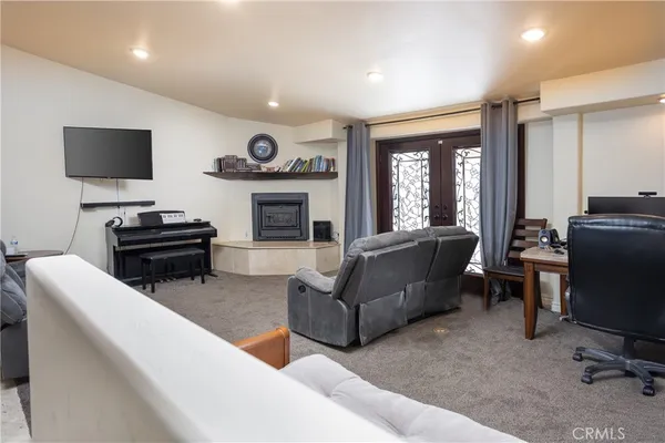 a kitchen with stainless steel appliances granite countertop a refrigerator sink and stove