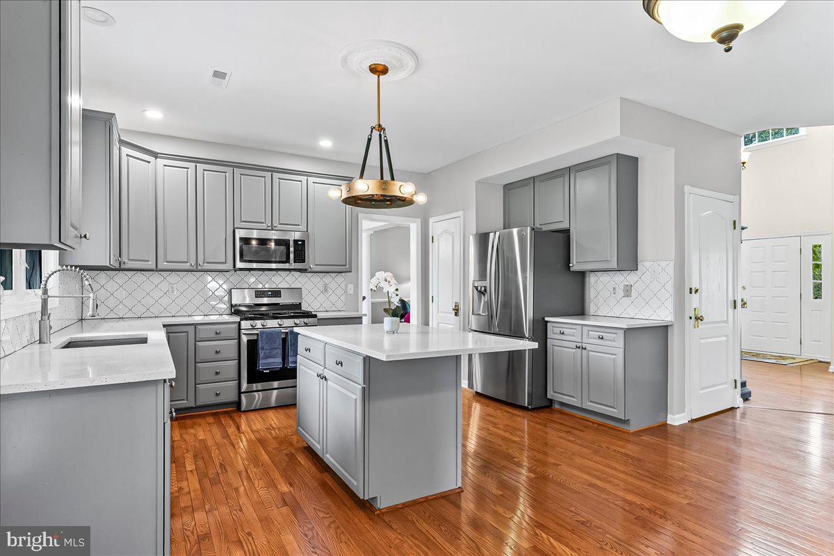 408 Brentford Road Kennett Square, PA 19348 - Photo 11 of 41 a kitchen with white cabinets stainless steel appliances and sink