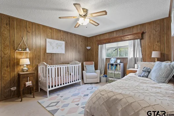 a bedroom with a bed and a view of bedroom