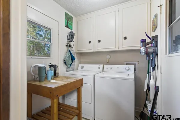 a kitchen with stainless steel appliances granite countertop a refrigerator stove and sink