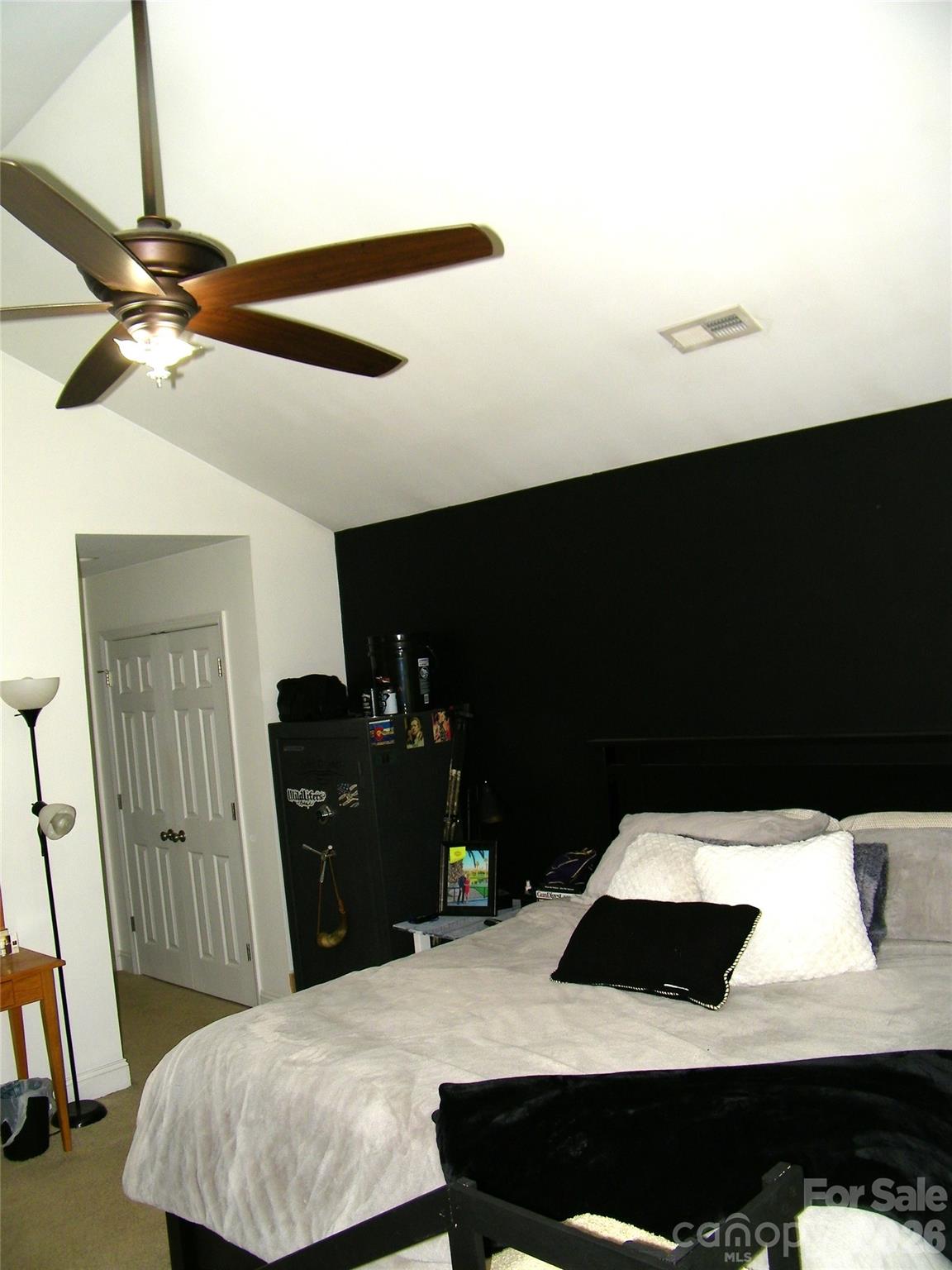 609 Redah Avenue Locust, NC 28097 - Photo 14 of 37 a bedroom with a bed and wooden floor