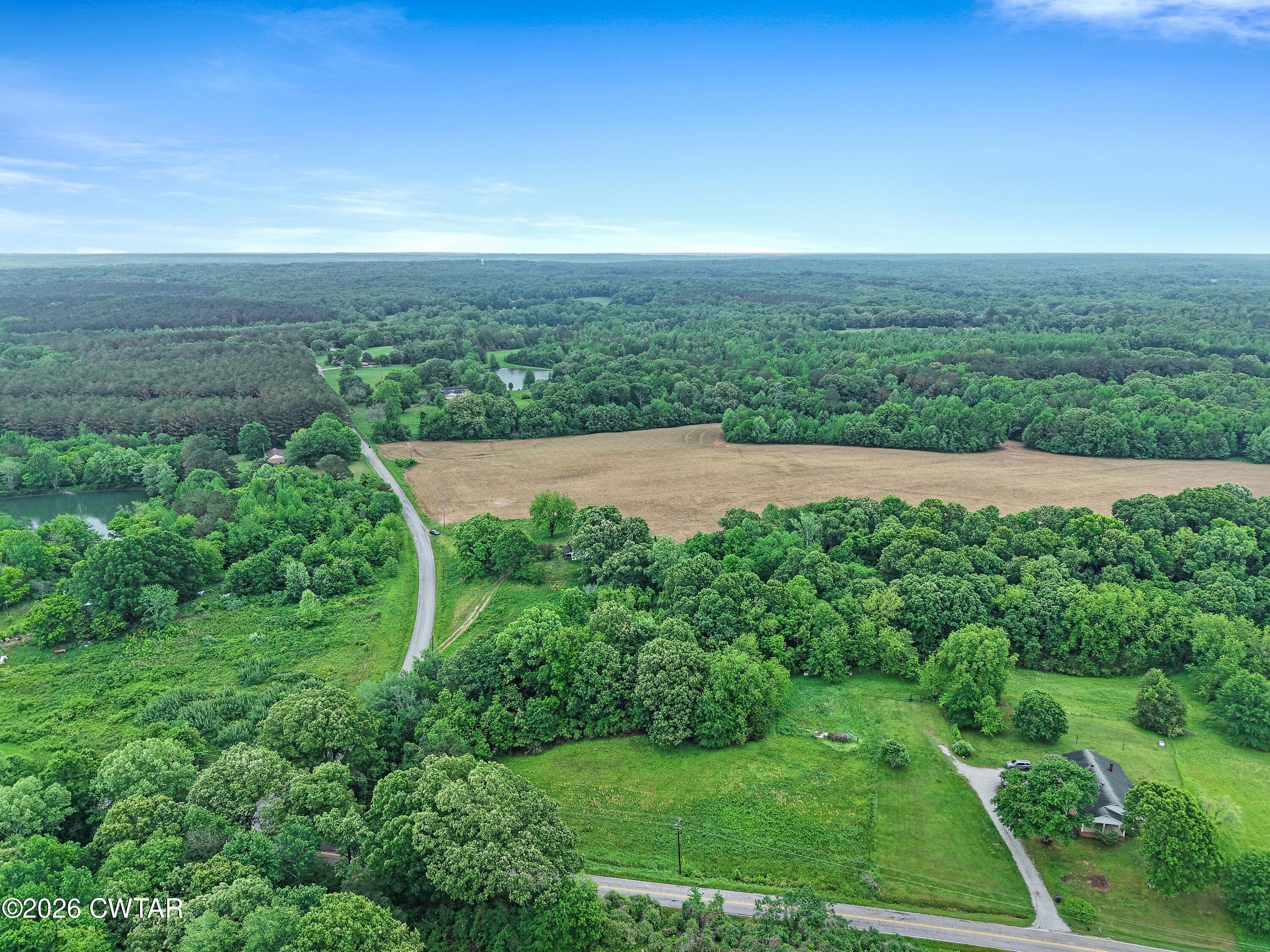 1525 Mill Creek Road Cedar Grove, TN 38321 - Photo 7 of 15 an aerial view of residential houses with outdoor space and trees